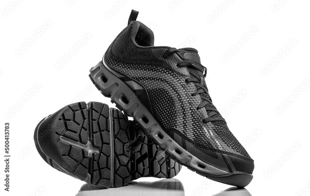 Sport shoes isolated on white background. Black sneakers running shoes.