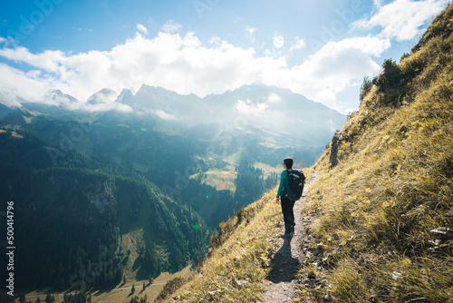 A female Hiker enjoying the view of Allgaeuer Alps, Germany