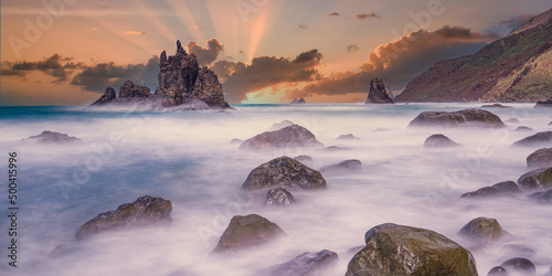 stunning sunset from the beach of benijo in tenerife. Canarian islands. Travel concept.