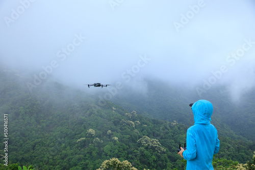Fototapeta Naklejka Na Ścianę i Meble -  Flying drone in spring forest