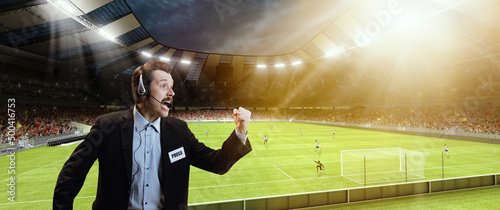 Emotional man, professional sport commentator, pressman during football match isolated over sport stadium background. Sport, league, game