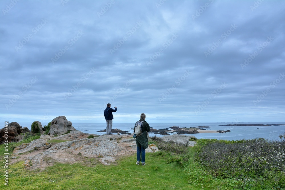 People watching the sea on the Milliau island of Trebeurden in Brittany-France