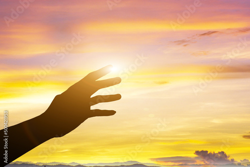 help with sunset background. silhouette of helping hands concept and international day of peace how can i help you