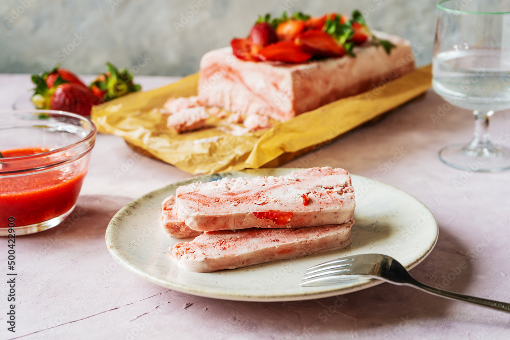 Italian strawberry dessert Semifreddo with sauce - cold dessert like an ice-cream. Selective focus Italian strawberry dessert Semifreddo with sauce - cold dessert like an ice-cream. Selective focus