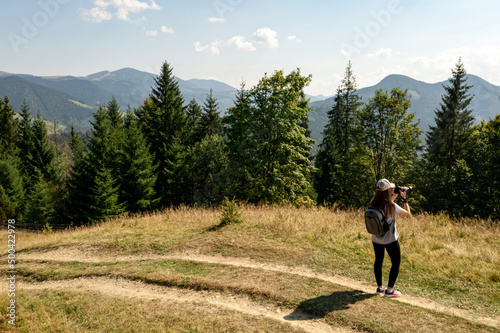 Professional photographer taking beautiful pictures in mountains © New Africa