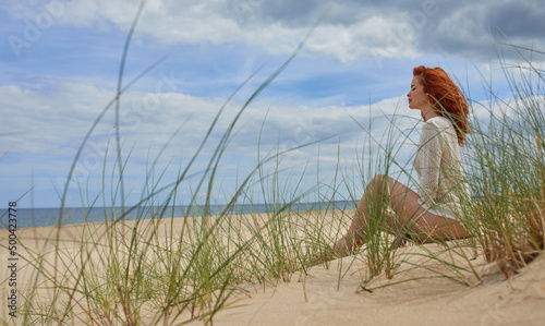 Girl sunbathing on white sand beach