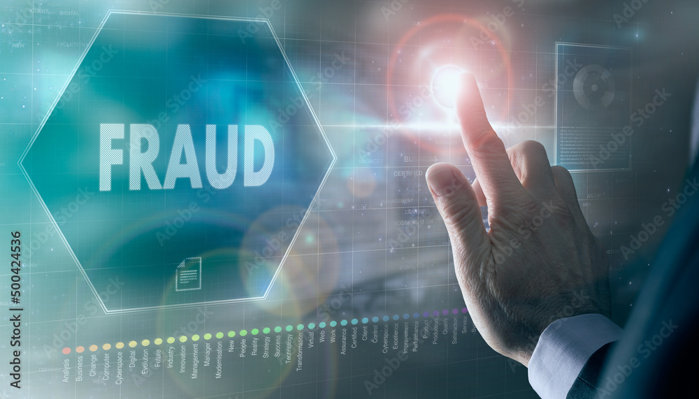 A businessman controlling a futuristic display with a Fraud business concept on it.