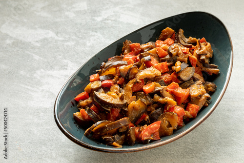Stir-fried eggplant, shiitake mushrooms and peppers with miso paste dish. Vegan cuisine.