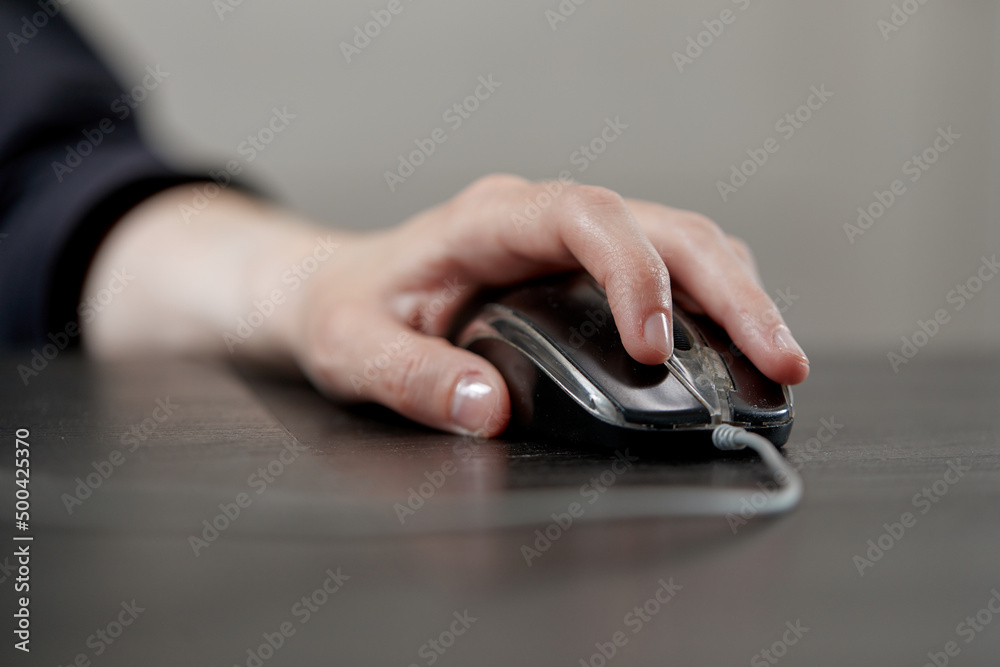 close up of businesswoman using computer mouse close up of businesswoman using computer mouse
