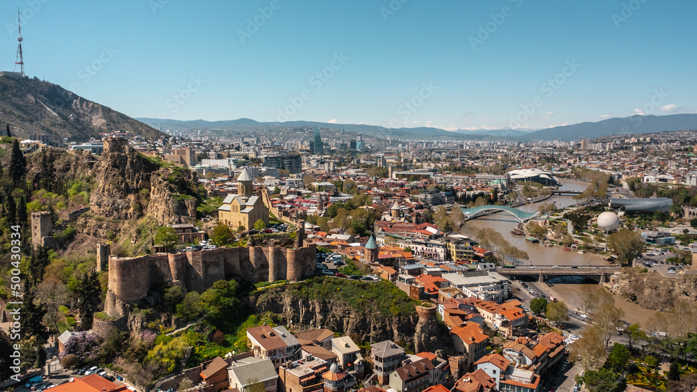 Cityscape of Tbilisi on a sunny day. Aerial view