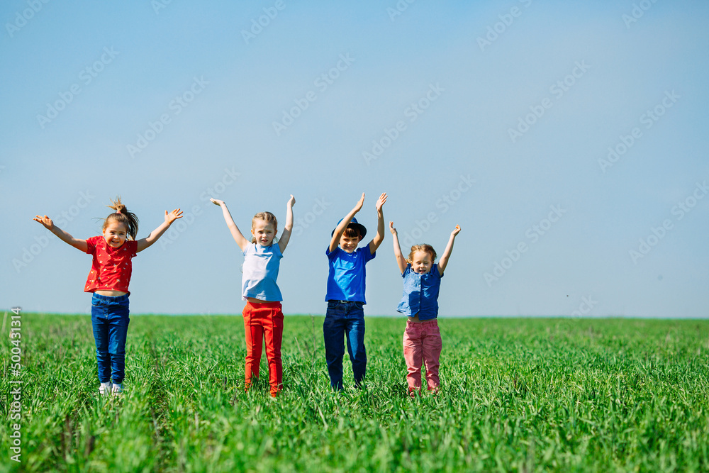 Running kids in green field during summer. Running kids in green field during summer.