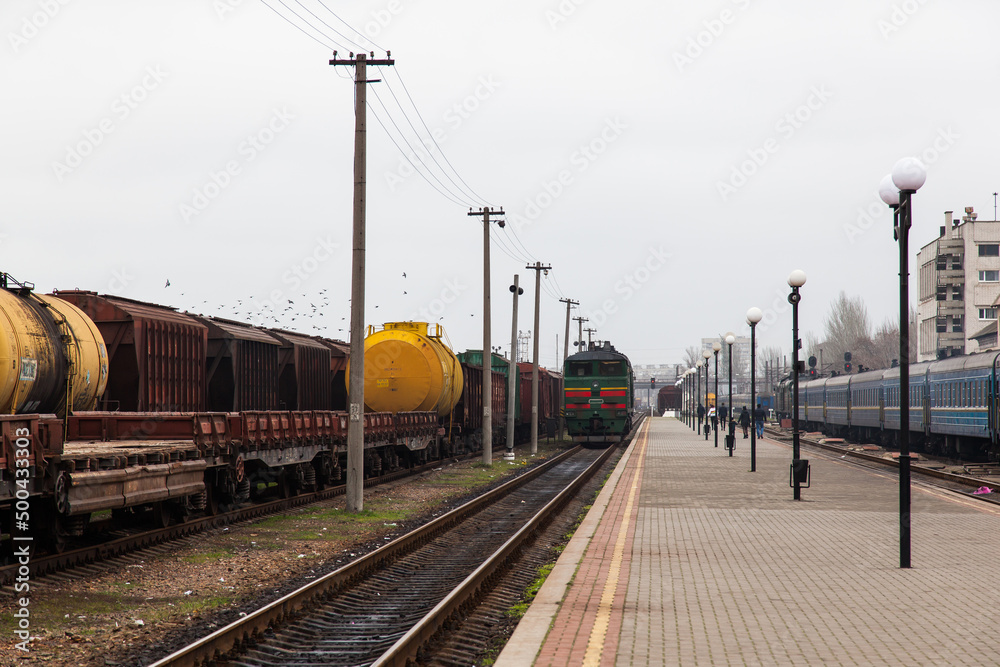 Freight and passenger trains at Kherson railway station in Ukraine.
