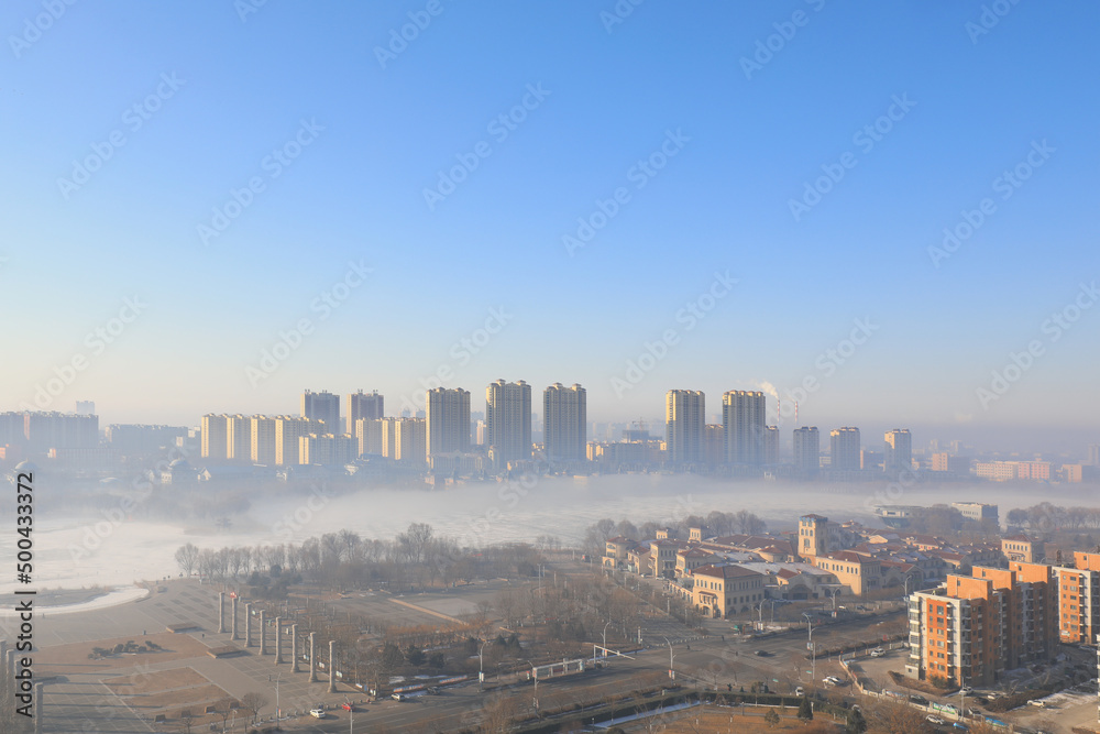 Obraz premium Buildings in advection fog, beautiful urban scenery, North China