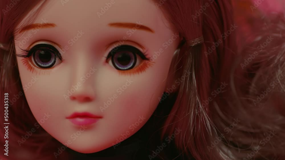 Beautiful doll. Close up. Portrait of attractive toy's face with big eyes. Beautiful doll. Close up. Portrait of attractive toy's face with big eyes.