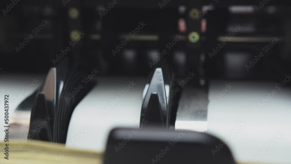 A special counter sets the exact number of bucks close-up. The machine counts dollars. Bills with Benjamin Franklin fall like a fan A special counter sets the exact number of bucks close-up. The machine counts dollars. Bills with Benjamin Franklin fall like a fan