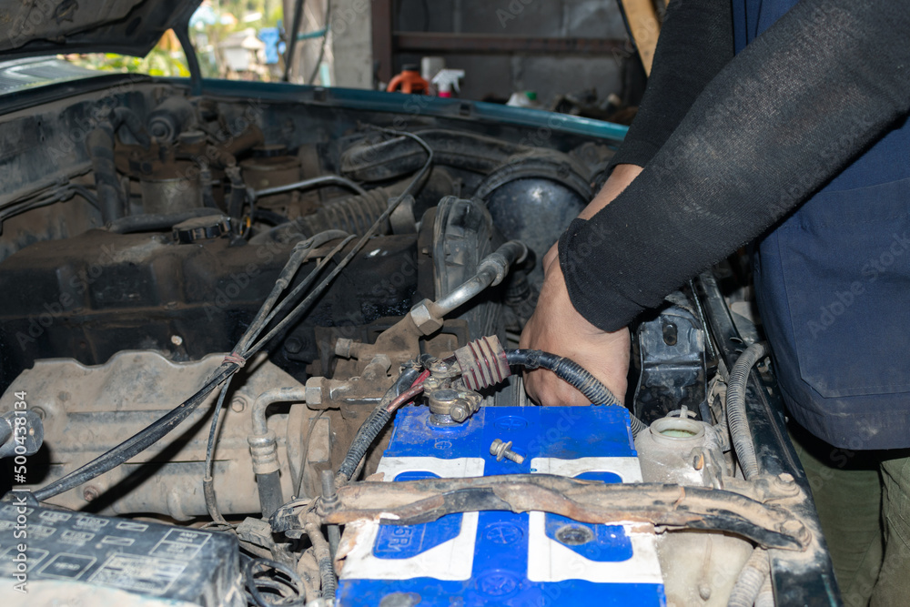 Fototapeta premium The mechanic is checking the engine.