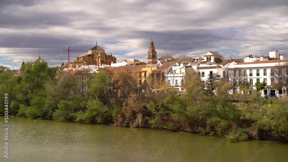 River with background view of Mezquita and city in Seville, Spain River with background view of Mezquita and city in Seville, Spain