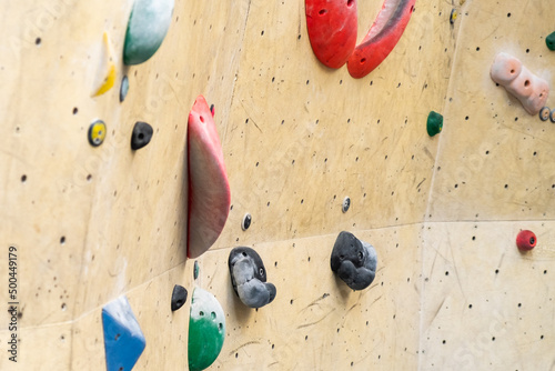 Stone hook on the artificial climbing wall in bouldering gym.  photo