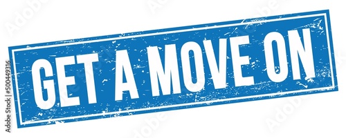 GET A MOVE ON text on blue grungy rectangle stamp.