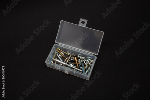 A small box with screws and bolts