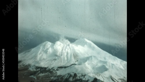 Adak Snowy Peak 1947 - Flying over a frozen Adak Island in Post World War II Alaska photo