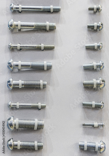 bolt with thread of different sizes on the counter as a sample