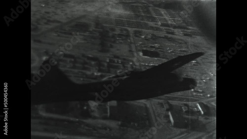 Black Widow Adak Flying 1947 - A Northrop P-61 Black Widow banks over Adak Airfield in post war Alaska. photo