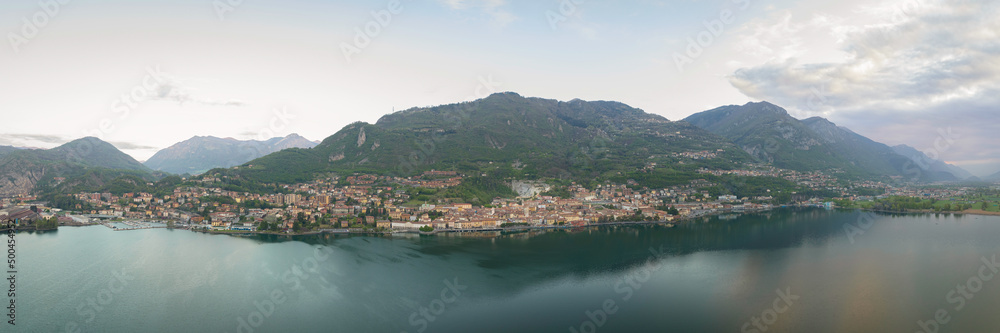 Aerial view of Lake Iseo at sunrise,panorama of all the city of lovere which runs along the lake,Bergamo Italy.
