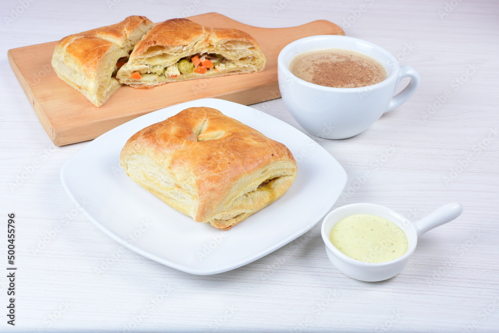 Puff pastry cake with vegetables and cheese, on wooden background Puff pastry cake with vegetables and cheese, on wooden background