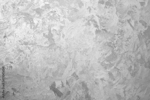 Fotografie Gray wall with decorative Venetian plaster. Background texture