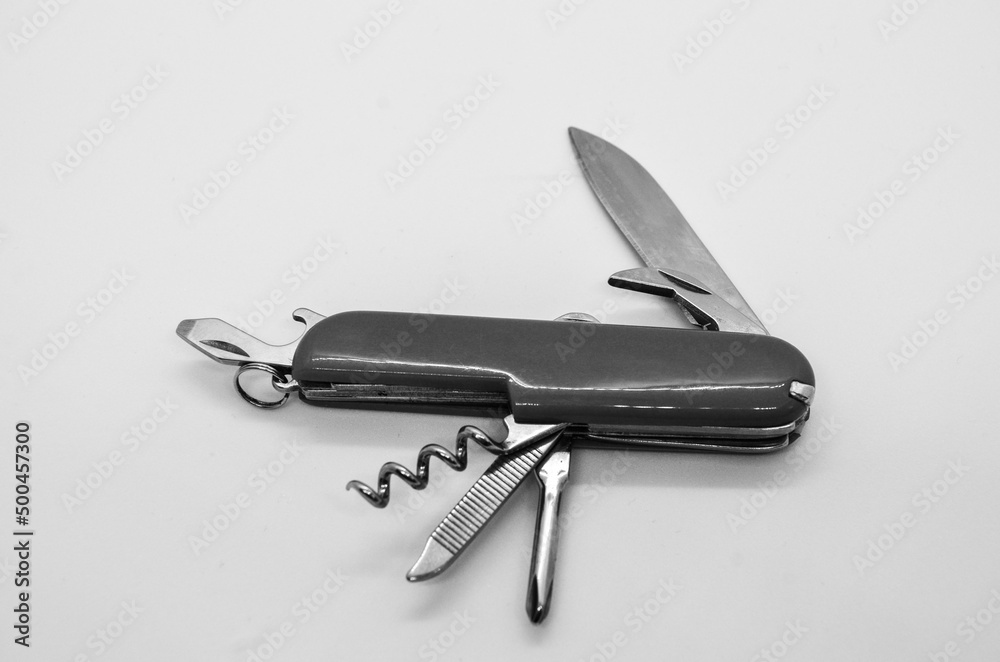 Isolated black and white switzerland knife, multi tool opened swiss army knife with wine opener in white background Isolated black and white switzerland knife, multi tool opened swiss army knife with wine opener in white background