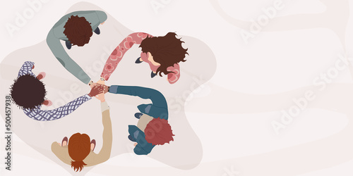 Diverse and multicultural people in a circle with hands on top of each other. Top view. Diversity people. Racial equality. Concept of teamwork community and cooperation.Diverse culture