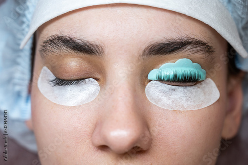 Fotobehang Caucasian woman on eyelash lamination procedure