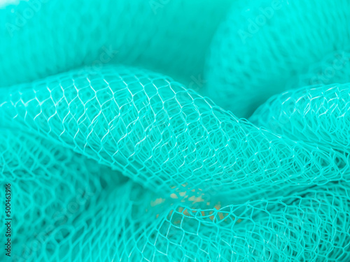 Abstract background of turquoise color mesh for grid pattern, rough and layer texture