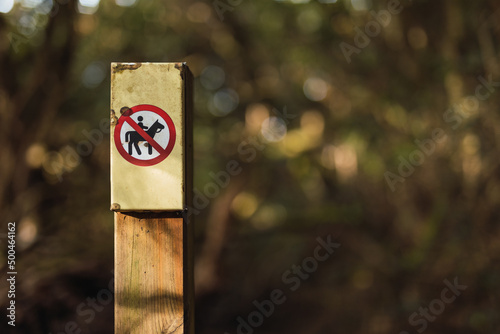 No riding animals allowed sign in the bush