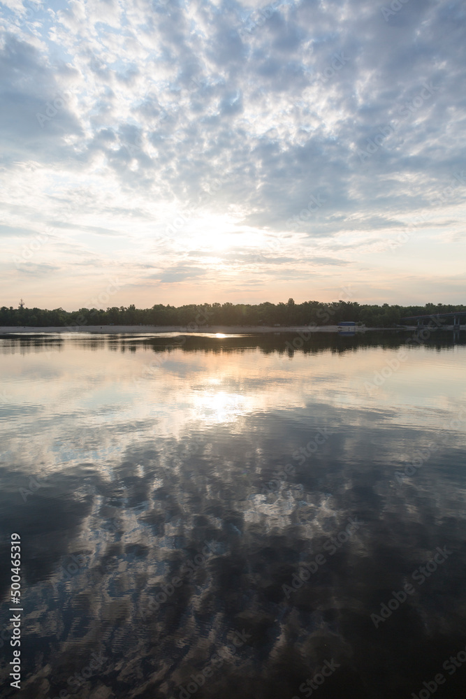 Peaceful sunrise in the sunny morning on the Dnipro river, Kyiv Harbour city, Ukraine.