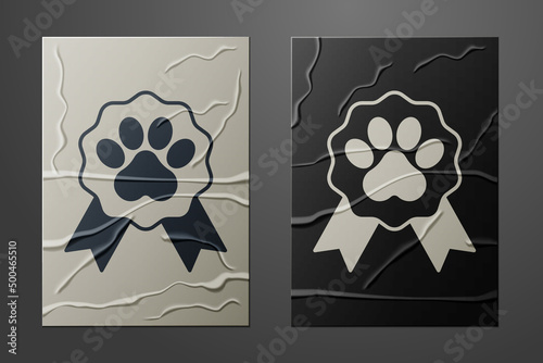White Pet award symbol icon isolated on crumpled paper background. Badge with dog or cat paw print and ribbons. Medal for animal. Paper art style. Vector