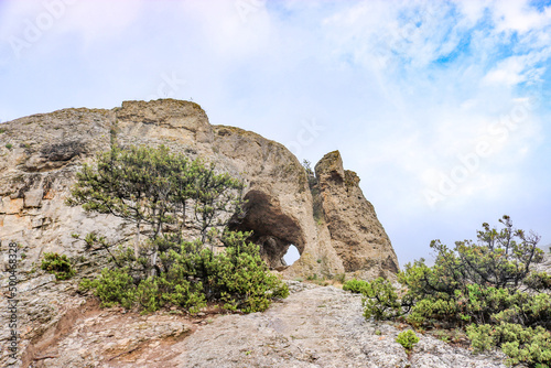 Arch in the mountains - grot Aeolian harp, Sudak, Crimea.