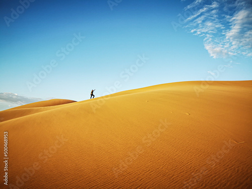 man standing on a dune