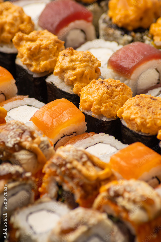 Japanese cuisine, set of fresh fish rolls close-up Japanese cuisine, set of fresh fish rolls close-up