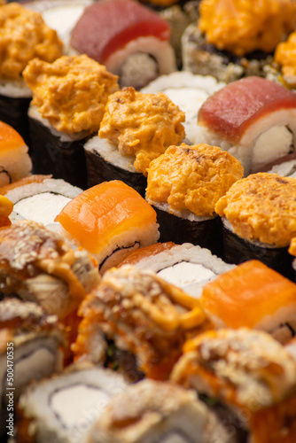 Japanese cuisine, set of fresh fish rolls close-up