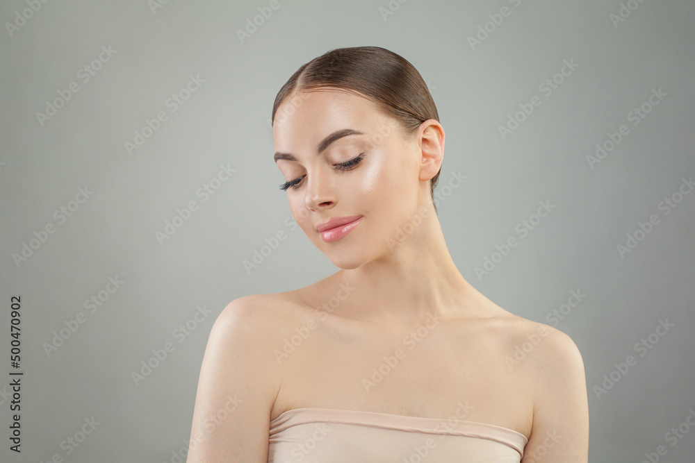 Perfect young woman with fresh shiny clean skin, studio portrait. Facial treatment, skin care and natural beauty concept Perfect young woman with fresh shiny clean skin, studio portrait. Facial treatment, skin care and natural beauty concept