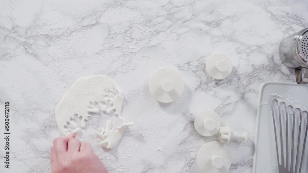 Flat lay. Step by step. Rolling our white fondant on a marble counter. Flat lay. Step by step. Rolling our white fondant on a marble counter.