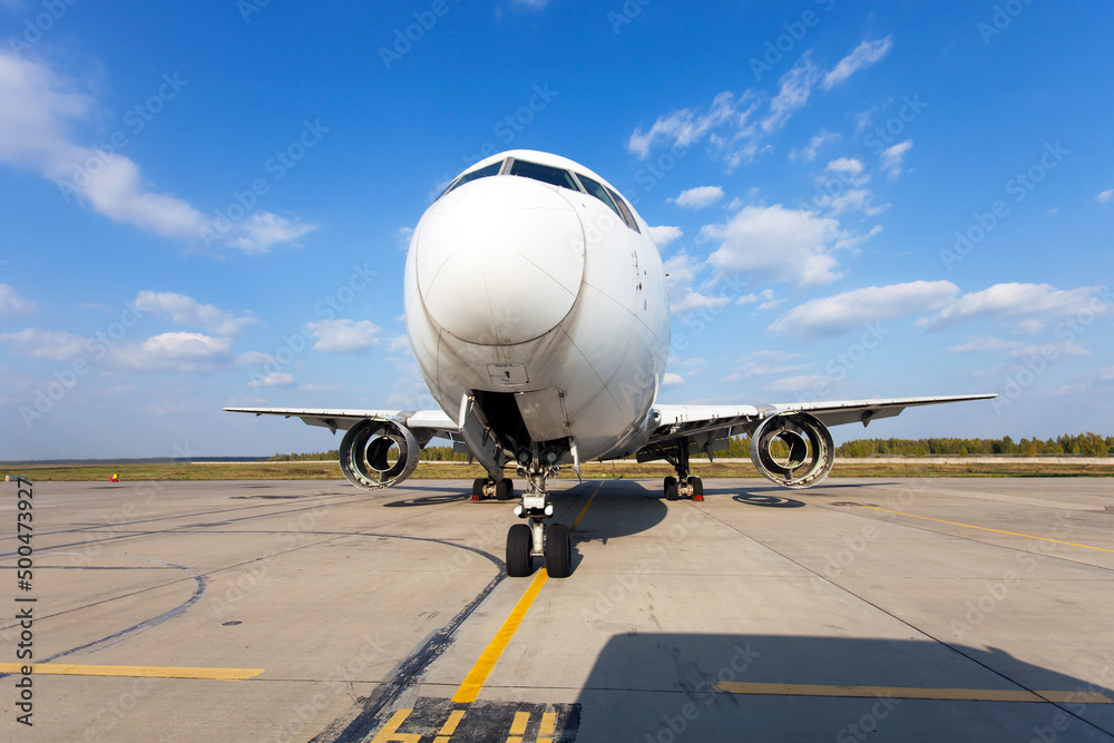 Modern passenger aircraft in the airport. Airplane without engines during the heavy maintenance. Front view. Modern passenger aircraft in the airport. Airplane without engines during the heavy maintenance. Front view.