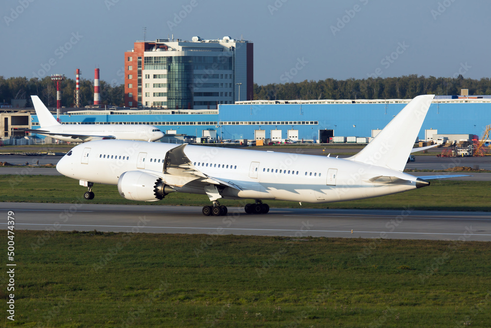 Passenger plane takes off from the airport runway Passenger plane takes off from the airport runway