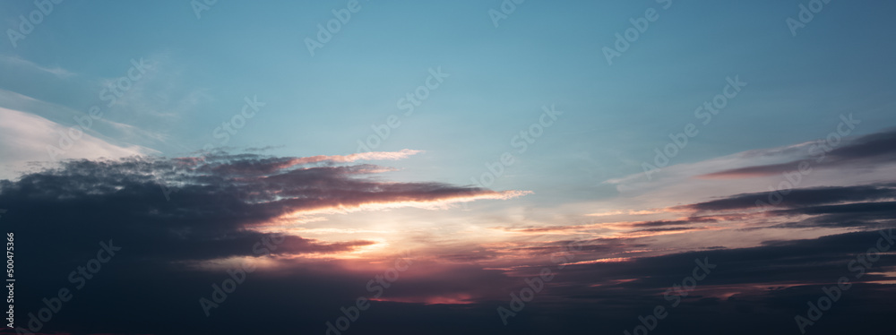 Panoramic banner view of beautiful sunset. Pastel colors.