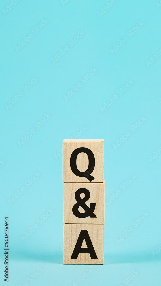 Q and A - acronym from wooden blocks with letters, questions and Q and A - acronym from wooden blocks with letters, questions and