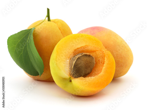 Apricots with leaves.