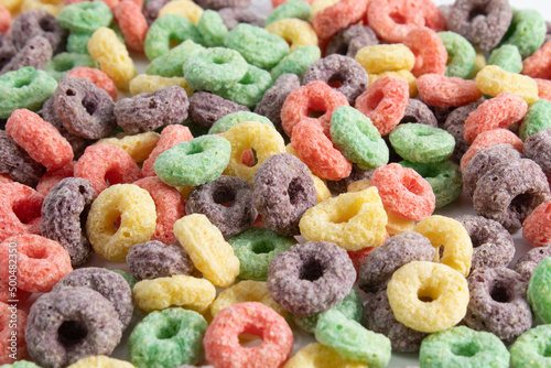 Multicolored breakfast cereal texture. Healthy and tasty fruit flavored cereal