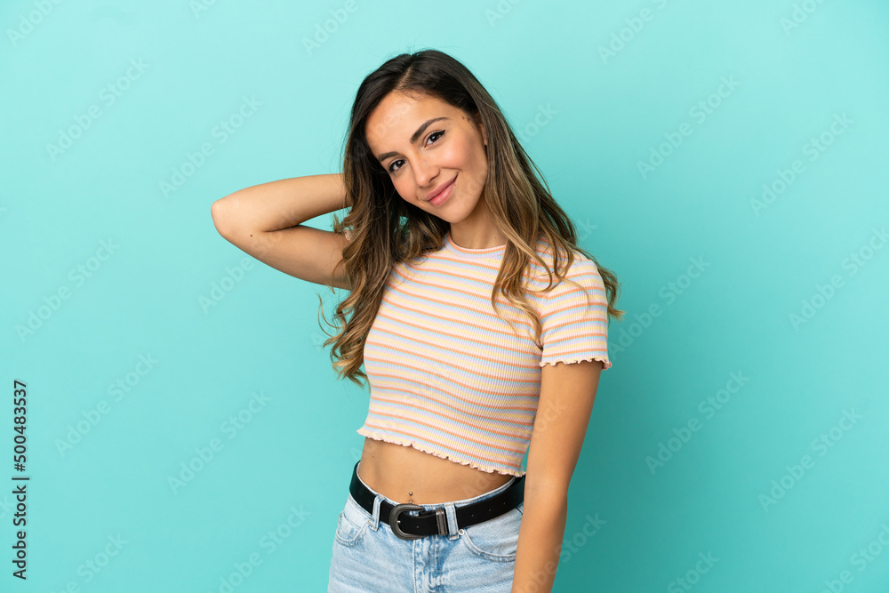 Young woman over isolated blue background laughing Young woman over isolated blue background laughing